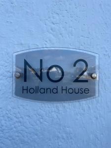 Majutusasutuses Holland House No2 olev sertifikaat, autasu, silt või muu dokument