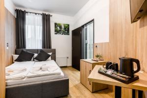 Postel nebo postele na pokoji v ubytování Hotel Montenegro