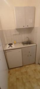 a small kitchen with a stove and a sink at Love Greece Dream Pavlaras in Tolo +13 photos