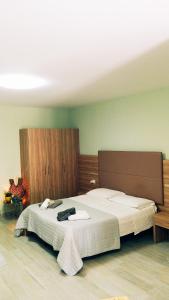 Postel nebo postele na pokoji v ubytování Casa Pizzarelli