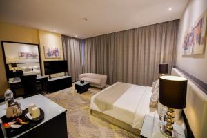 Postel nebo postele na pokoji v ubytování Grand Villaggio Hotel Abu Dhabi
