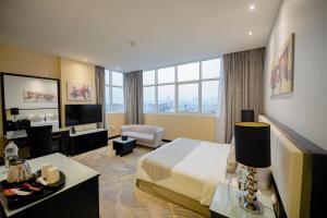 Postel nebo postele na pokoji v ubytování Grand Villaggio Hotel Abu Dhabi