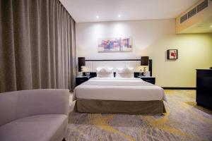 Postel nebo postele na pokoji v ubytování Grand Villaggio Hotel Abu Dhabi