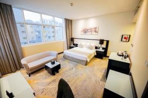 Postel nebo postele na pokoji v ubytování Grand Villaggio Hotel Abu Dhabi