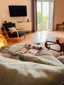 a living room with a tv and a couch at House Jelka in Supetar