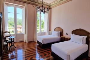 Ένα ή περισσότερα κρεβάτια σε δωμάτιο στο Casa Palacio de Esgos +51 φωτογραφίες