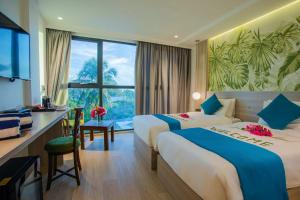 Voodi või voodid majutusasutuse Beach Hotel Guraidhoo toas