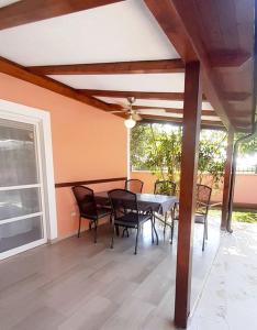 a dining room with a table and chairs on a patio at Mario and Maria in Vodnjan