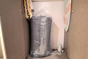 a bag is sitting in a corner of a room at Evo Soho Bangi by Renjana Homestay in Bandar Baru Bangi +6 photos