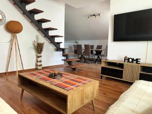 a living room with a tv and a coffee table at Nirvana in Tivat