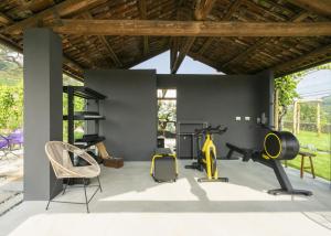 a gym with exercise equipment in a house at Vigne Di Fagnano - Langhe, Cuneo in Santo Stefano Belbo