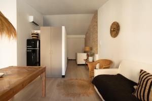 a living room with a couch and a table at San Borja Boutique 2 in Gandía