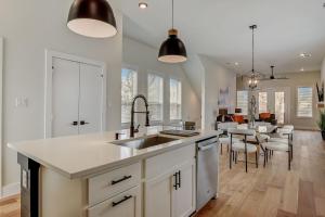 a kitchen with a sink and a counter top at Munice at Trinity Grove in Dallas