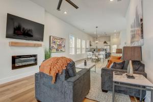 a living room with a couch and a table at Munice at Trinity Grove in Dallas
