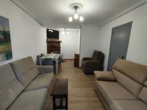 a living room with a couch and a table at Casa GLORIA in Ganuza