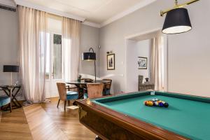 a living room with a pool table at Villa Paola 16 in Campiglia Marittima