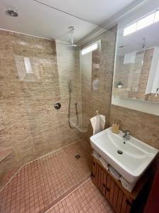 a bathroom with a sink and a shower at stylish suite OldTown free parking Air Condition in Heidelberg