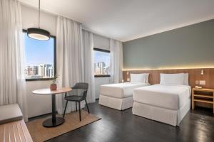 Cama ou camas em um quarto em INNSiDE by Meliá São Paulo ITAIM