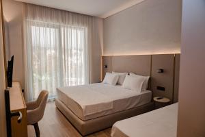 Postel nebo postele na pokoji v ubytování Riviera Blu- Seaside Hotel