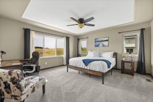 a bedroom with a bed and a ceiling fan at Ponderosa Mile in Rapid City