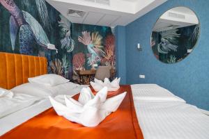 Postel nebo postele na pokoji v ubytování Hotel Atlantis Wellness & Conference
