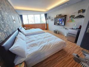 Postel nebo postele na pokoji v ubytování 晟品溫泉湯旅 宜蘭縣058號