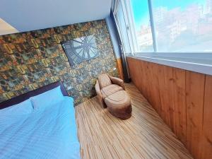 Postel nebo postele na pokoji v ubytování 晟品溫泉湯旅 宜蘭縣058號