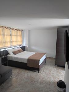 Voodi või voodid majutusasutuse Hotel Palmas De Alcalá toas
