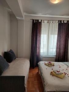 Ένα ή περισσότερα κρεβάτια σε δωμάτιο στο Apt Iva 2