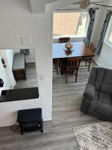 a living room with a table and a couch at Oceanview Cabin 20 Private Jacuzzi Pet Friendly in Smith River