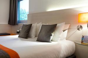 Postel nebo postele na pokoji v ubytování Best Western Colmar Expo