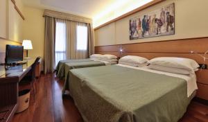 Postel nebo postele na pokoji v ubytování Best Western Hotel Dei Cavalieri + 37 fotografií