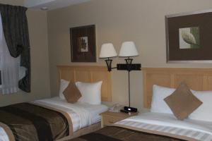 Voodi või voodid majutusasutuse Clearwater Hotel Ltd toas