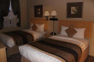 Voodi või voodid majutusasutuse Clearwater Hotel Ltd toas