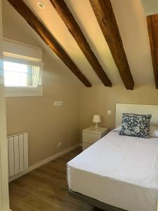 Кровать или кровати в номере La Casona del Asno