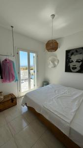 Postel nebo postele na pokoji v ubytování Plaka Beach House Naxos