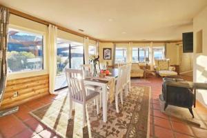 a living room with a table and chairs and a couch at Panorama Paradiso by CasadeLuz, 5Acre 360 Retreat close to Old Town Temecula Wine Country in Temecula