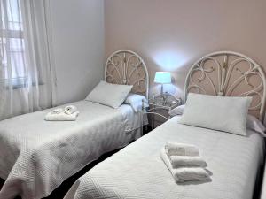 Postel nebo postele na pokoji v ubytování Apartamento Villa de Noia