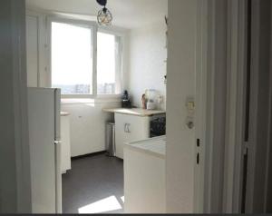 Kuchyň nebo kuchyňský kout v ubytování Appartement avec vue panoramique