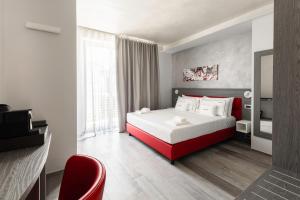 Un pat sau paturi într-o cameră la Corso49 Boutique Rooms