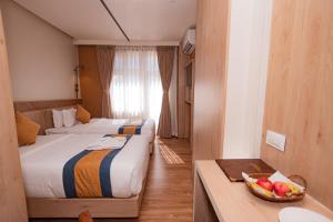 Postelja oz. postelje v sobi nastanitve Hotel Vistara