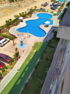 an overhead view of a pool at a resort at برتو جولف مارينا in El Alamein
