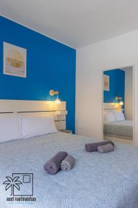 Postel nebo postele na pokoji v ubytování 21 Ineika Corralejo iRent Fuerteventura + 37 fotografií