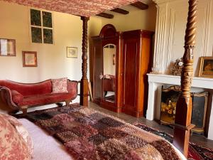 a living room with a couch and a fireplace at No 41 Chambres D hotes in Confolens