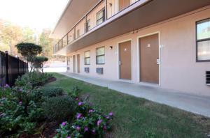 a building with a row of doors on the side of it at Americas Best Value Inn - Malvern in Malvern