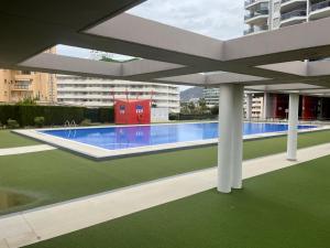 a view of a swimming pool in a building at Pequeno paraiso in Ifach