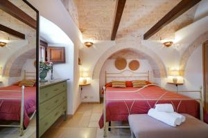 A bed or beds in a room at Dimora Monte Grappa