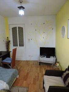 Ένα ή περισσότερα κρεβάτια σε δωμάτιο στο Toscana Apartament