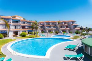 an image of a swimming pool at a resort at Casa Lago Azul 49 in Los Cancajos