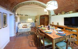 a dining room with a wooden table and chairs at Pet Friendly Home In Cetona in Cetona